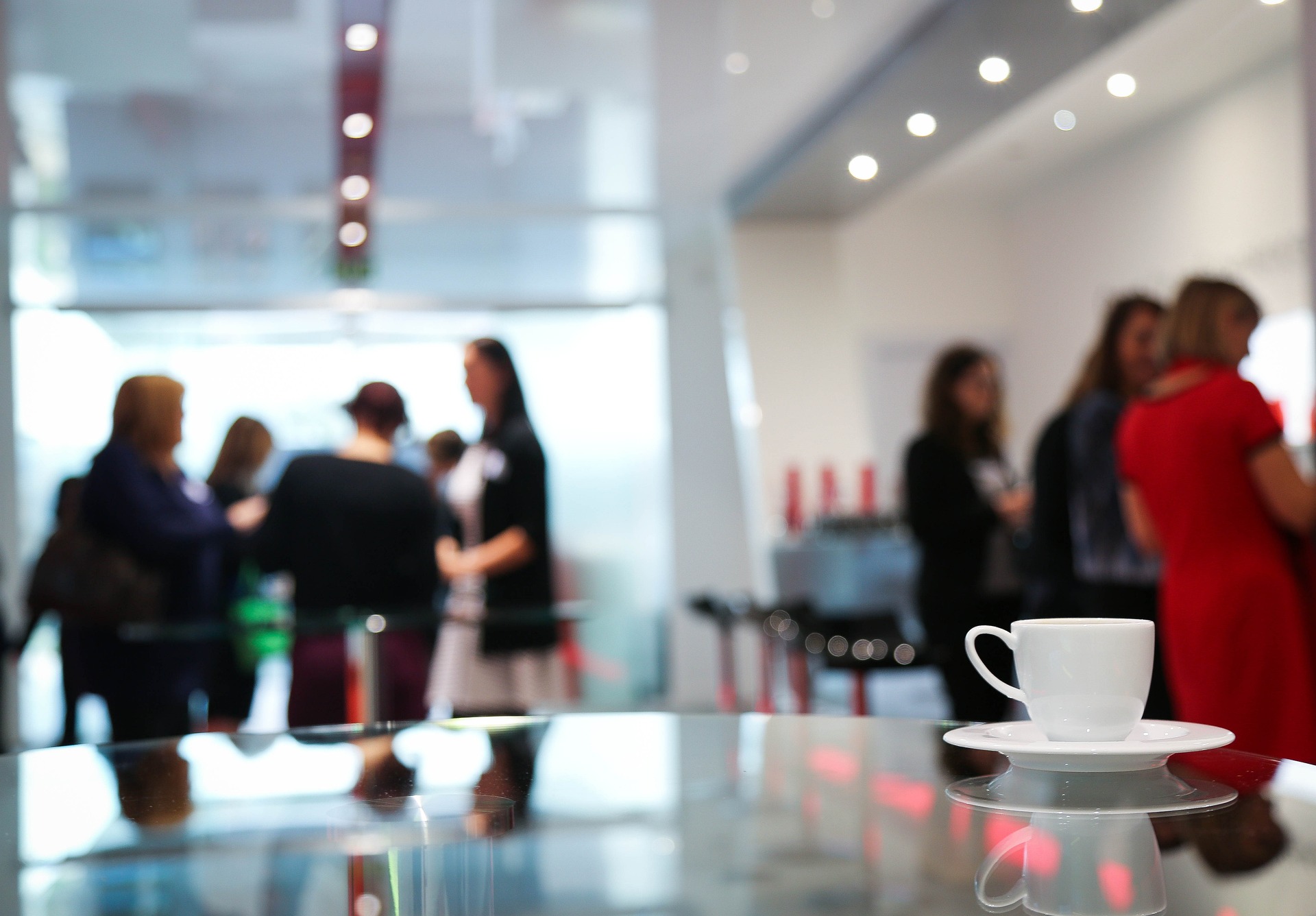 Group of people standing around a conference centre
